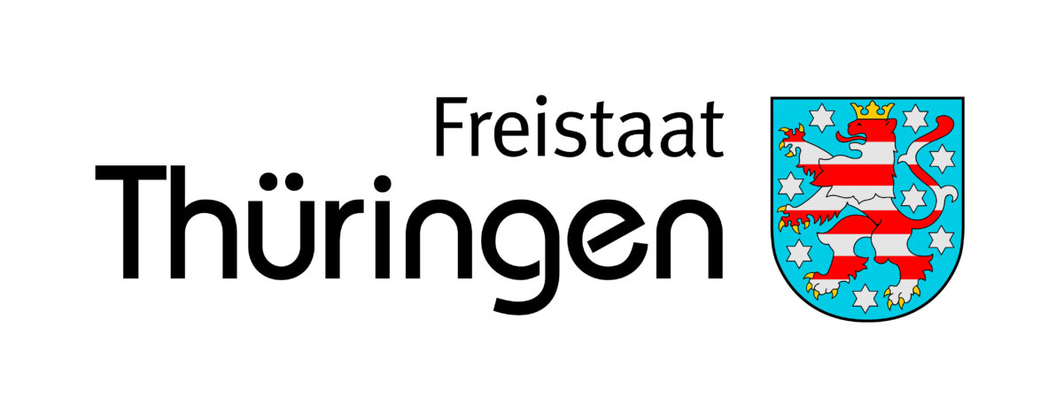 Auf dem Bild sieht man das blau-weiß-rote Logo des Freistaats Thüringen.