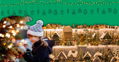 Auf dem Bild ist ein Kind zu sehen, das von vielen weihnachtlichen Dingen umgeben ist. Das Bild vermittelt die festliche Atmosphäre eines Weihnachtsmarktes.